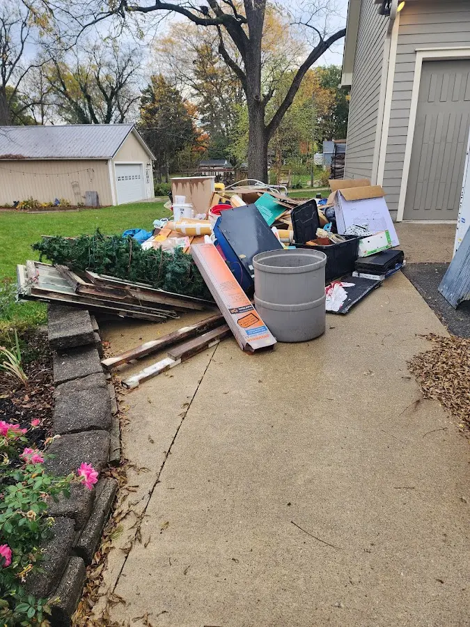 Dumpster being loaded with debris for 3 Yard Dumpster Rental in Conewago